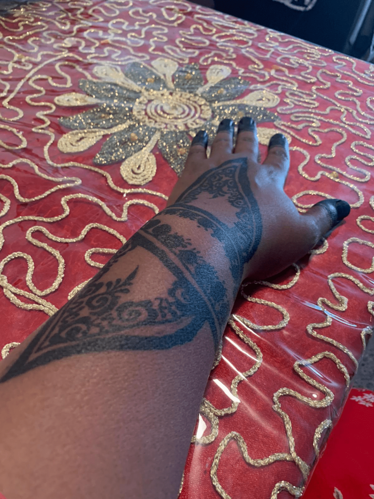 A hand with a henna tattoo, the participant who took this photo talked about feeling close to her sister without being together